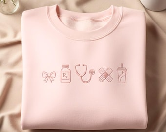 Embroidered Nurse Icon Sweatshirt: Coquette Healthcare Apparel