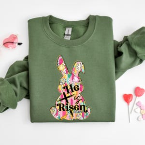 a green shirt with a bunny on it