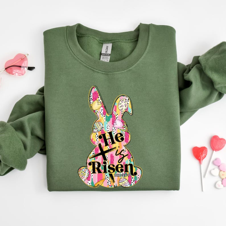 a green shirt with a bunny on it