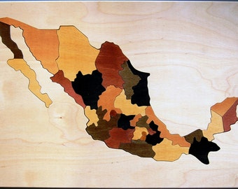 Wooden map of Mexico puzzle with states printed on tray and and capitals on backs of pieces - an educational toy for kids and adults alike