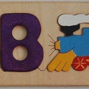 Wooden Name puzzle with choo-choo train shape - a cute birth gift, first birthday, or holiday gift for train loving boys or girls.