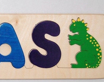 Wooden Name puzzle with added Dinosaur shape, cute gift for toddlers who love dinos, by Puzzle People