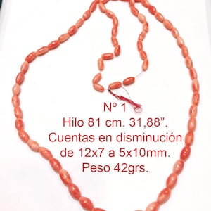 Peut inclure: Un collier de perles de corail de taille graduée, allant de 12x7 mm à 5x10 mm. Le collier mesure 81 cm de long et pèse 42 grammes. N° 1