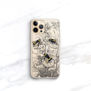 May include: A clear phone case with a black and white illustration of bees and flowers. The case has a gold trim around the camera lenses.