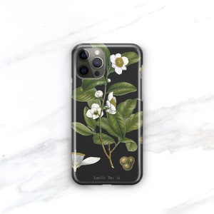 May include: Black phone case with a white floral design and the text "Camellia Thea L."