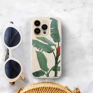 Tropical iPhone case with a banana leaf botanical design on a clear background. Shown on an iPhone 16 pro