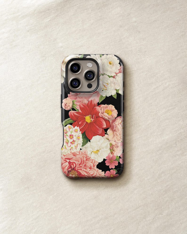 a phone case with a floral design, including red and white flowers, on a white background.