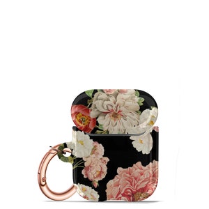 May include: A black floral print Airpods case with a rose gold carabiner clip. The case has a floral pattern with pink, white, and red flowers on a black background.