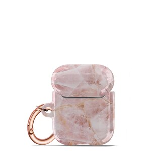 May include: A pink and white marble patterned Airpods case with a rose gold carabiner clip.