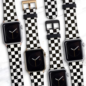 May include: Five Apple Watch bands with a black and white checkered pattern. The bands are made of leather and have a classic look.