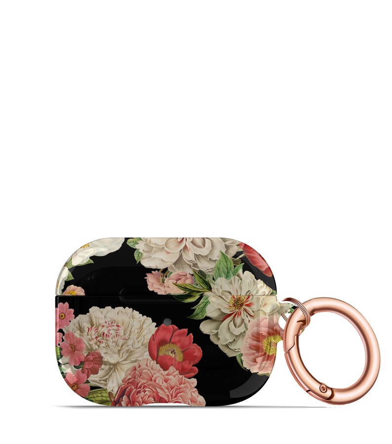 May include: A black floral print Airpods case with a rose gold carabiner clip. The case features a variety of pink, white, and green flowers on a black background.