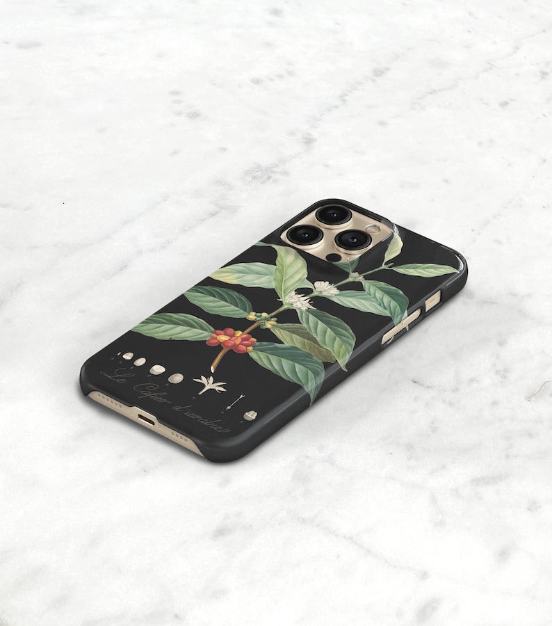 espresso phone cover for iPhone 16 Pro. A black phone case with a floral design. The design features a branch of coffee beans with green leaves and white flowers.