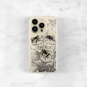 May include: A clear phone case with a black and white illustration of three bumblebees on a flower. The case has a clear back and a white border.