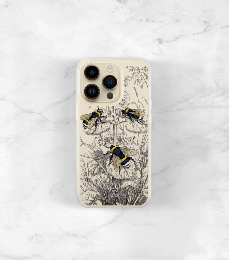 May include: A clear phone case with a black and white illustration of three bumblebees on a flower. The case has a clear back and a white border.