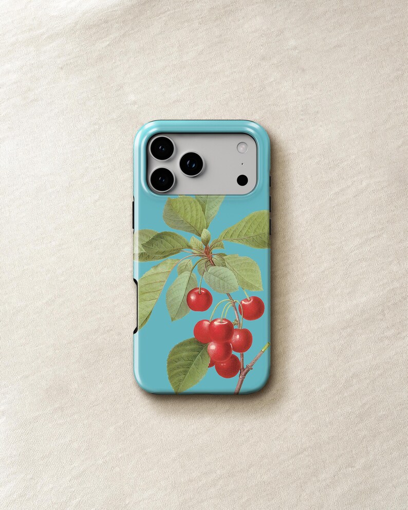 a phone case with a design of cherries and leaves on a blue background.