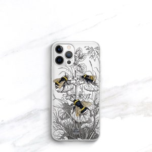 May include: A clear phone case with a black and white illustration of bees and flowers. The case has a cutout for the phone's camera.