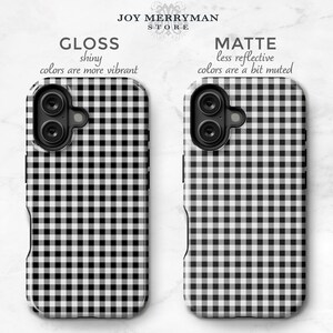 May include: Two phone cases with a black and white gingham pattern. One case is glossy, with vibrant colors, and the other is matte, with muted colors. The text "JOY MERRYMAN STORE" is at the top.