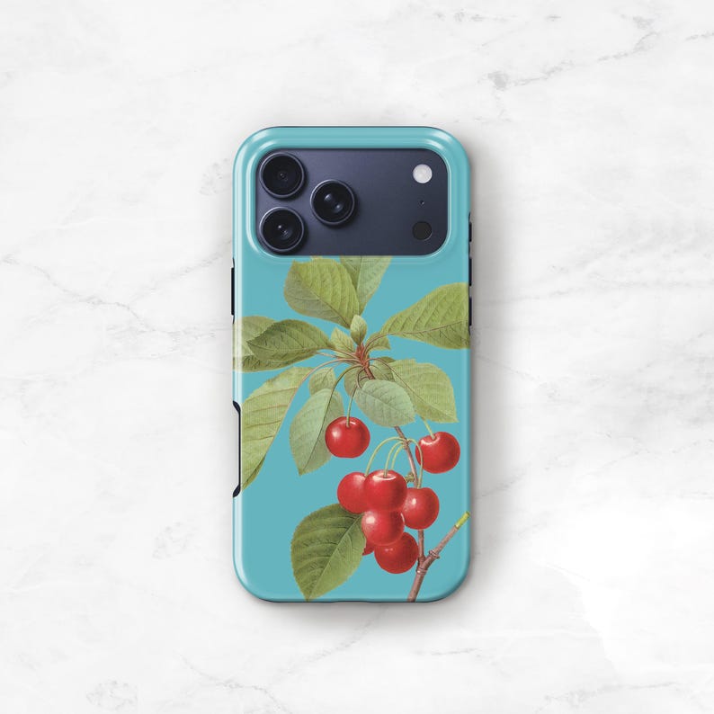 a phone case with a design of cherries on a branch, with red cherries and green leaves.