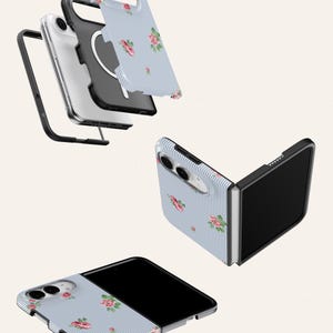 a collection of three smartphone cases with floral designs. The cases are in various stages of being assembled, with one partially open and the other two fully assembled.