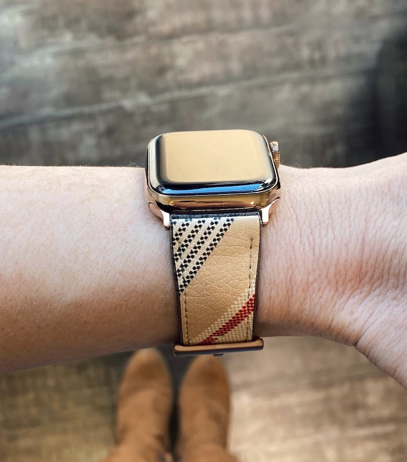 41mm Apple Watch band in designer plaid with rose gold buckle and lugs. The Nova Check pattern is large scale and on the diagonal. Camel color accented with black, tan and red.