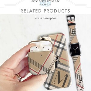 May include: A set of three phone accessories in a beige and black plaid pattern. The set includes a phone case, a watch band, and a case for AirPods. The phone case has a large letter "M" on the back.