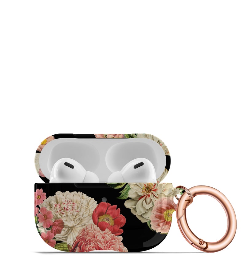 May include: A black floral print Airpods case with a rose gold carabiner clip. The case has a white interior and is open to reveal the white Airpods.