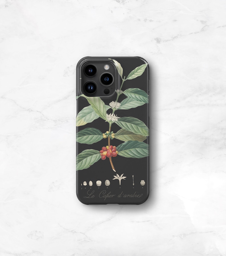 botanical coffee phone case. A black phone case with a white and green  illustration of a coffee plant with red berries. The text 'Le Cafe d'arabice' is printed on the bottom of the case.