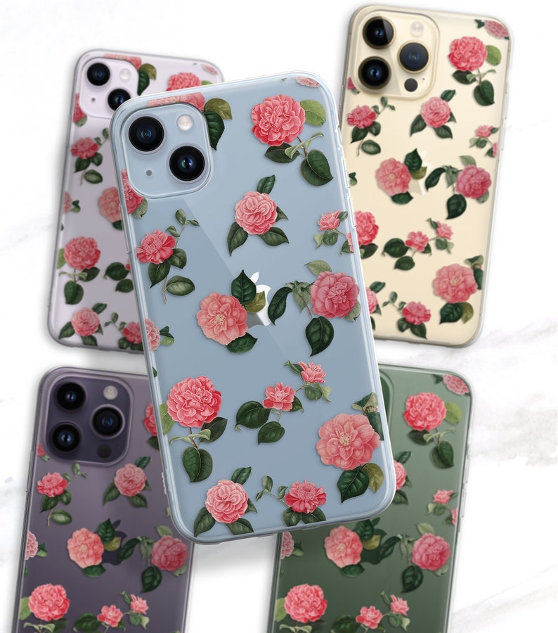 May include: Four different phone cases with a floral design. The cases are clear and show the phone's color underneath. The flowers are pink and white and have green leaves. The cases are all different colors: purple, blue, green, and yellow.