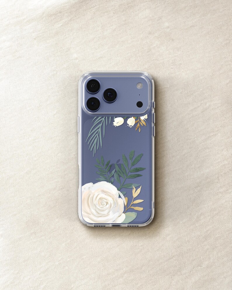 A clear phone case with a floral design on the back cover, featuring a white rose and green leaves.