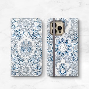 May include: A blue and white patterned phone case with a camera cutout. The case has a strap on the back.