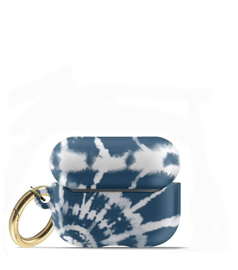 May include: A blue and white tie-dye patterned protective case for AirPods with a gold metal carabiner.
