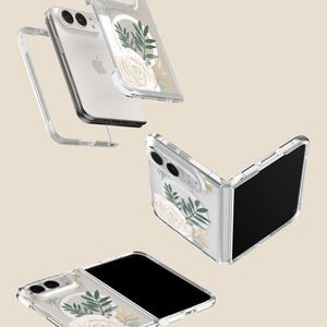 a clear phone case with a floral design, including white roses and green leaves. The case appears to be made of a transparent material, allowing the phone to be visible through the case.