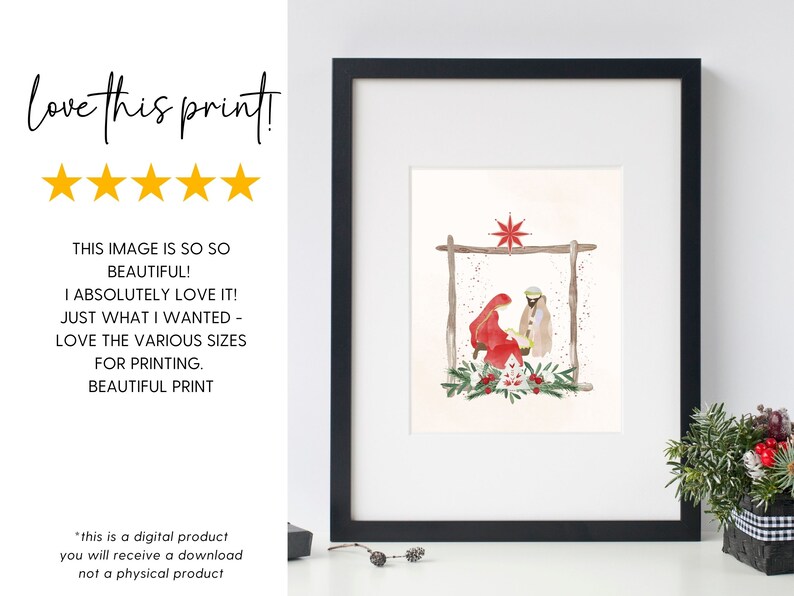 May include: A watercolor painting of the nativity scene with Mary, Joseph, and baby Jesus in a manger. The scene is set in a rustic barn with a star above. The painting is framed in a black frame and is hanging on a white wall.