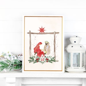 May include: A watercolor painting of the nativity scene with Mary, Joseph, and baby Jesus. The painting is set against a light pink background with a red star above the manger. The manger is made of wood and is decorated with green leaves and red berries.
