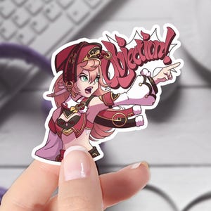 May include: A sticker featuring an anime-style character with pink hair, wearing a red and gold outfit, pointing and shouting "Objection!" in a speech bubble.
