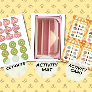 May include: A colorful activity set with cut-outs of pink pastries and green kiwi slices, a pink activity mat, and activity cards with baking lists. The text on the cards reads "List to Bake". The background is yellow with bee patterns.