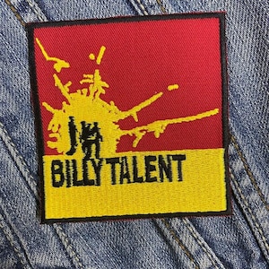 May include: A yellow and red embroidered patch with a black and yellow graphic of a splatter and the text "BILLY TALENT".