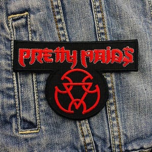 May include: Black and red embroidered patch with the text "Pretty Maids" in white stitching. The patch features a black circle with a red stylized symbol inside.