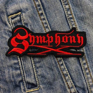 May include: Black and red embroidered patch with the word "Symphony" in a gothic font.