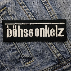 May include: Black and white embroidered patch with the text "böHSE onkelz" in white lettering on a black background.