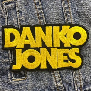 May include: Yellow embroidered "Danko Jones" patch on a blue denim jacket.