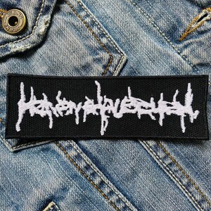 May include: Black and white embroidered patch with the text "Hatebreed" in a stylised font.