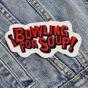 May include: White patch with red and black embroidered text that reads "Bowling for Soup!"