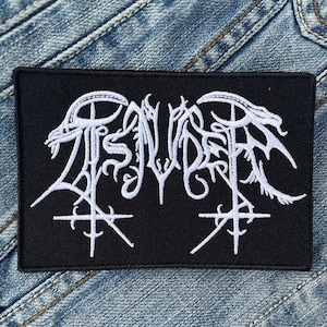 May include: Black embroidered patch with a white logo of the band "S U I C I D E" in a stylized font.