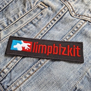 May include: Black and red embroidered patch with the text "limp bizkit" and a white and red graphic of a hand.