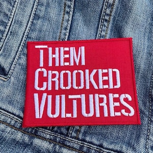 May include: Red embroidered patch with white text that reads "Them Crooked Vultures".