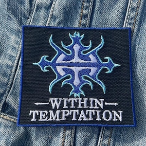 May include: A black patch with a blue and white stylized design and the text "Within Temptation" in white.