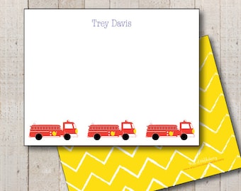 May include: Red fire truck stationery with the name "Trey Davis" printed at the top. The stationery has a yellow chevron pattern on the back.