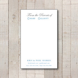 May include: A white card with black text that reads "From the Parents of Mary Elliott". Below the text is a contact section with the names "Kris & Paul Harris", email addresses "kris@email.com" and "paul@email.com", and phone numbers "Kris: 555.555.1234" and "Paul: 555.555.6789".