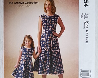 McCalls 7354:  Girls' Back-Wrap Dress Pattern, Sizes 3, 4, 5, 6, 7, and 8